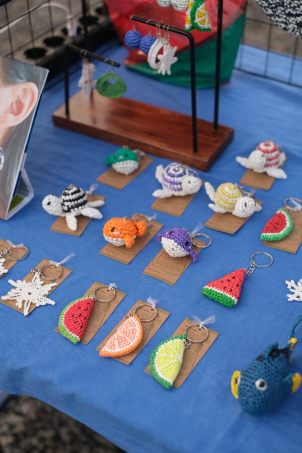 Variety of funky handmade keychains made from upcycled materials