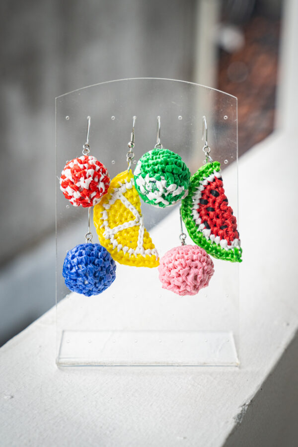Different colorful crochet earrings made from upcycled materials